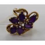 A 14ct gold amethyst and diamond set floral ring 11