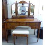 A modern burr walnut finished dressing table, the superstructure surmounted by a triptych mirror,