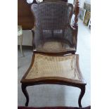 An early/mid 20thC French inspired mahogany showwood framed salon chair, the caned back,