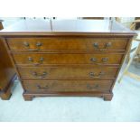 A modern crossbanded and burr walnut finished four drawer dressing chest,