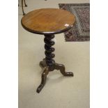 A mahogany occasional table