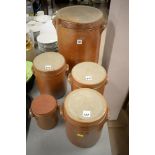 Five salt-glazed Stoneware Jars and Covers of varying sizes