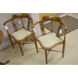 A pair of corner chairs