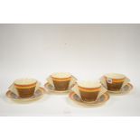 A set of four Clarice Cliff four cups and saucers.