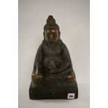 A Chinese bronze figure of a seated bearded...