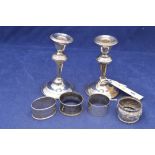 Silver candlesticks and napkin rings