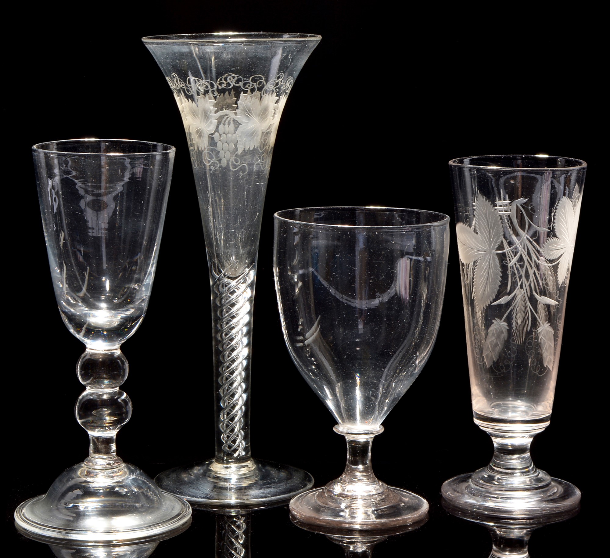 An ale glass; and three goblets.
