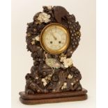 A rare and unusual Japanese carved mantel clock.