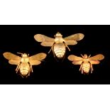 Three gold bee brooches, boxed