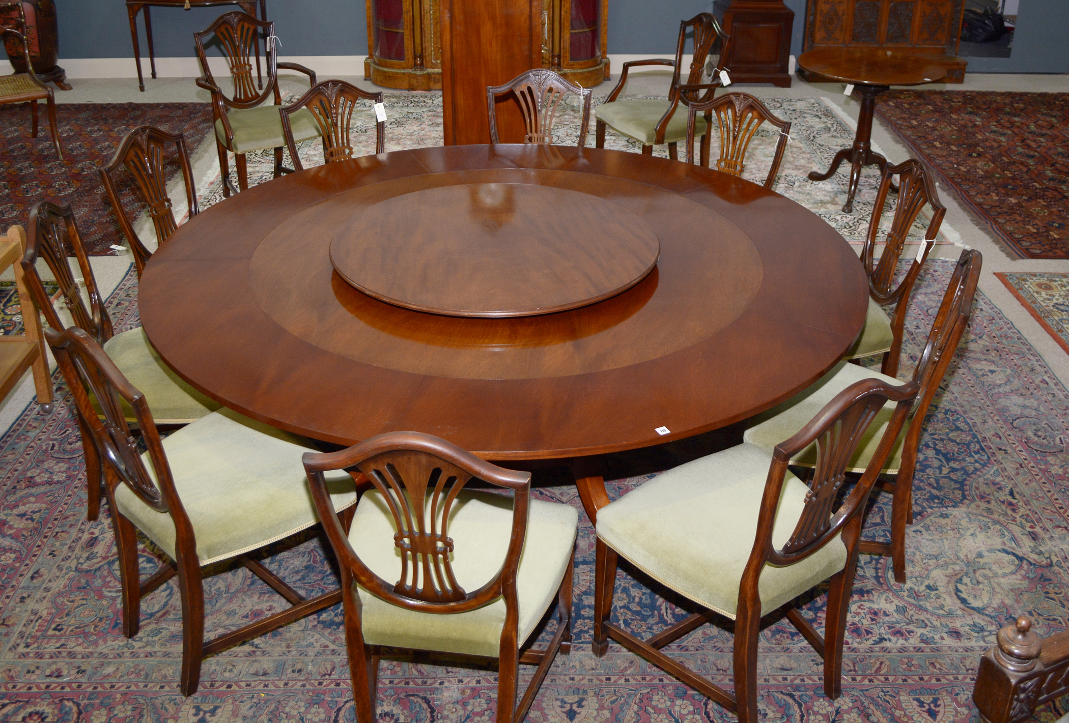 Chapmans 'Siesta' dining table., cabinet and twelve matching chairs