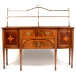An early 20th Century mahogany and satinwood banded breakfront sideboard.