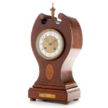 An early 20th Century inlaid mahogany mantel clock.