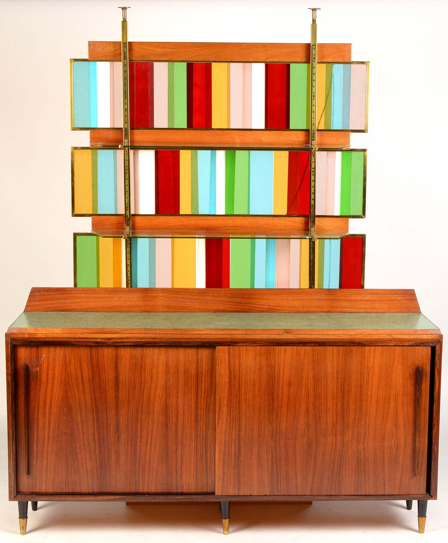 A cocktail bar; a rosewood sideboard; and a stained glass superstructure.