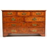 A North European mahogany and figured walnut chest..