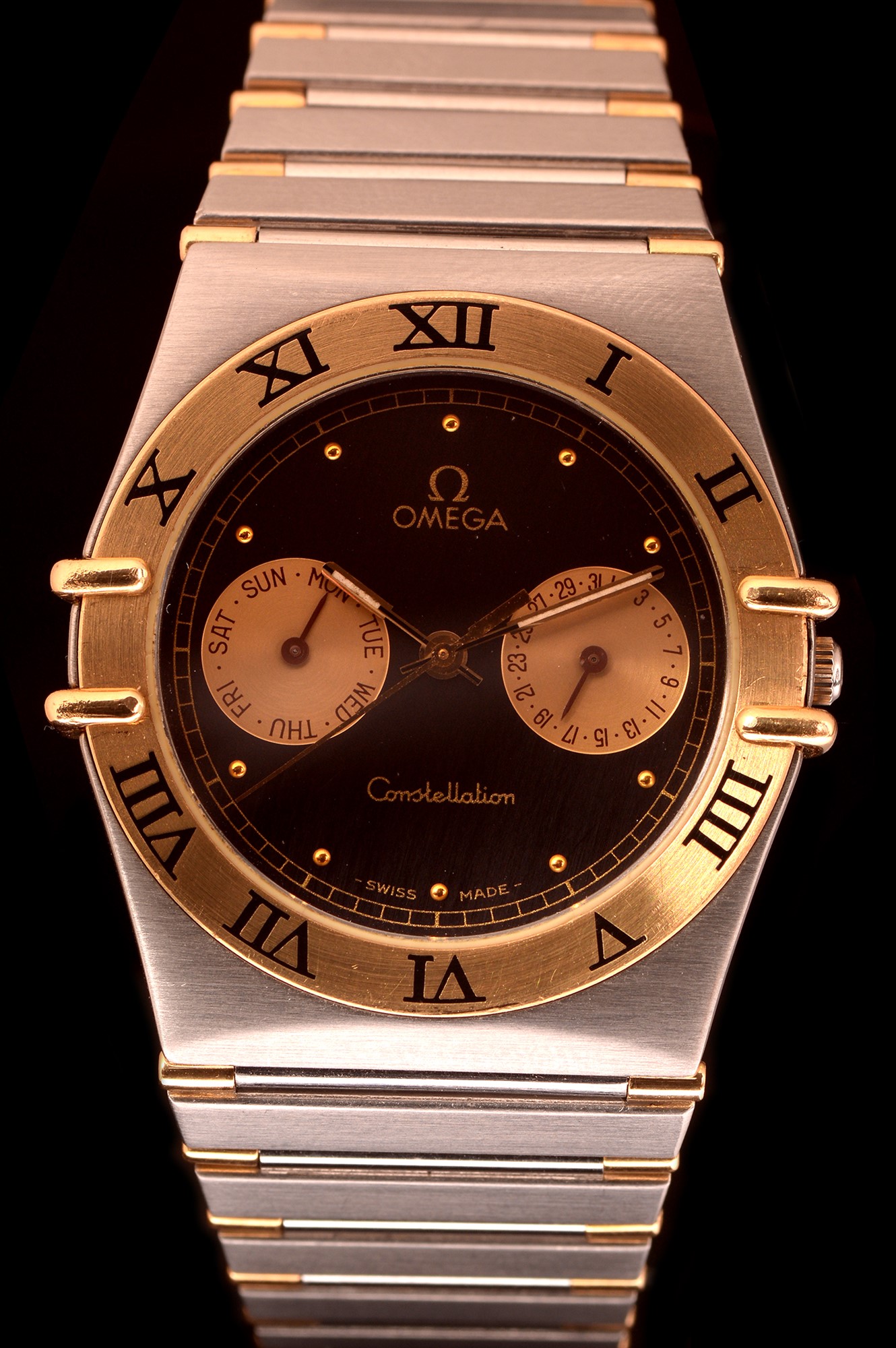 Omega Constellation: a 18ct gold & stainless steel quartz wristwatch,