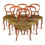 Six rosewood chairs.