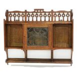 Manner of Shapland & Petter: an Arts & Crafts oak wall unit.