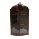 A Georgian mahogany glazed corner cupboard.