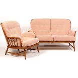 Ercol: a beech 'Jubilee' two-seater settee and matching easy chair