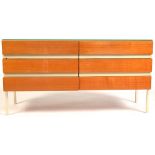 A mid 20th Century teak and painted chest of six drawers.