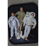 Three Action Man dolls with costumes.