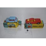 Two Corgi cars