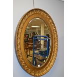 Oval gold mirror