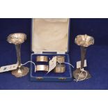 Silver candlesticks and napkin rings