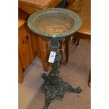 two cast iron bird baths