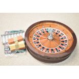 John Huxley roulette wheel, chips, stand and mat