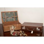 Straw hamper and a leather suitcase