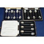 Silver coffee spoons and plated sugar tongs