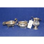 George III silver cream jug and two others