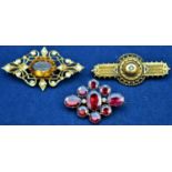 Three brooches