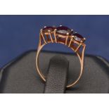 Three stone garnet ring