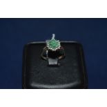 Emerald and diamond cluster ring