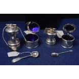 Two silver mustard pot and spoons; two pepper grinders