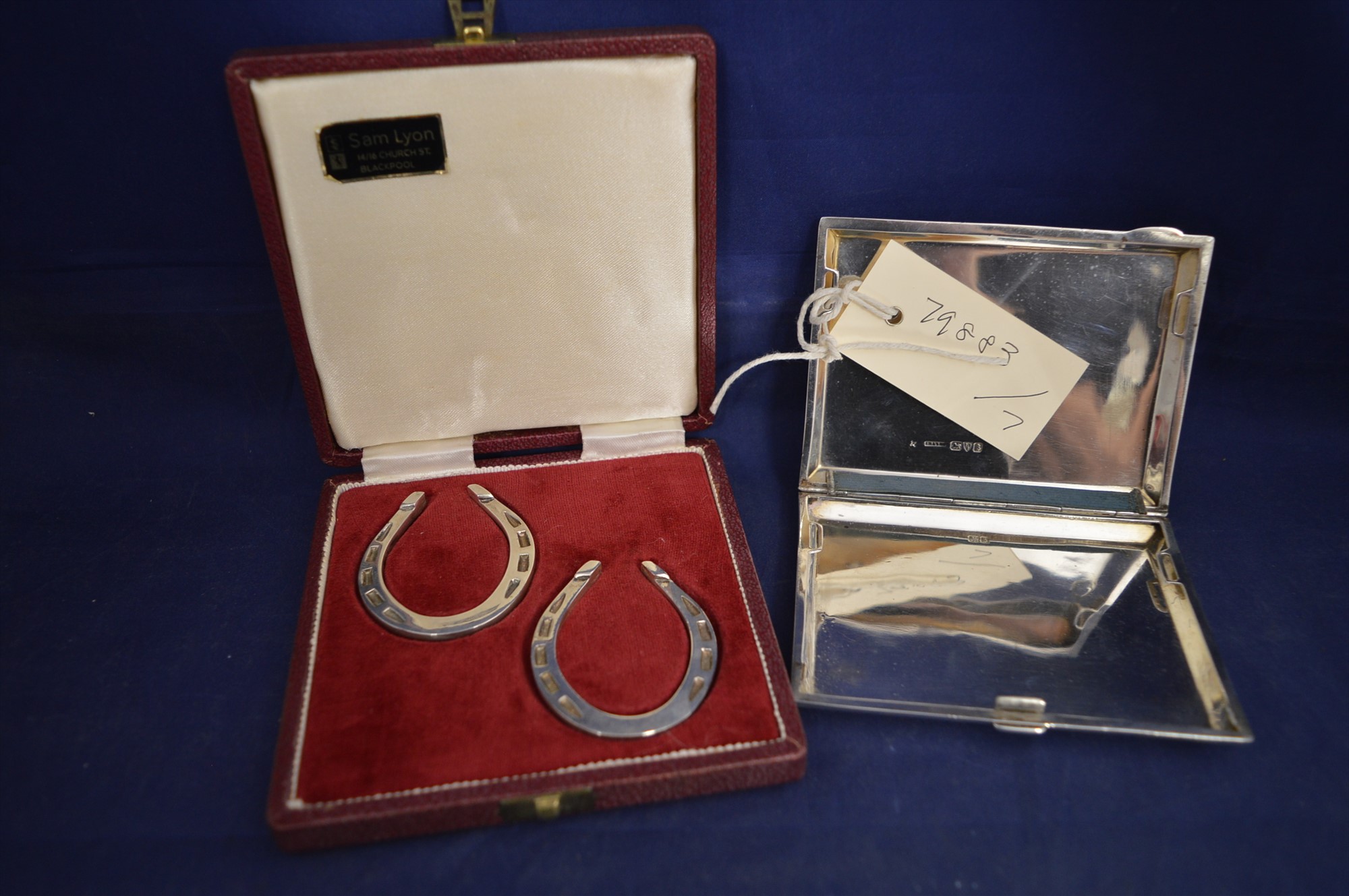 Silver horse shoes and cigarette case