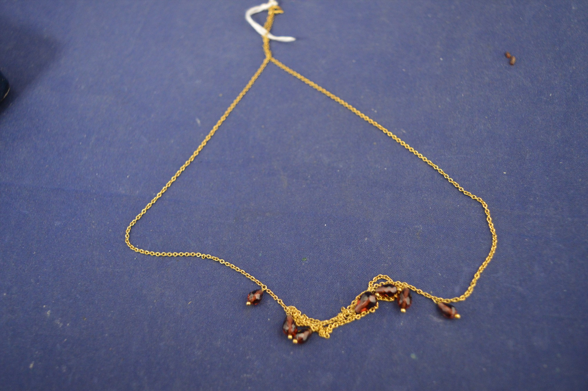 Gold and garnet necklace