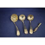 Three ladles and a toothbrush