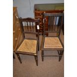Two canework chairs.