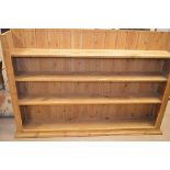 A stripped pine delft rack with flared cornice