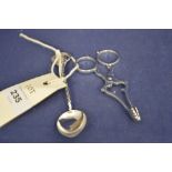 Silver tongs and teaspoon