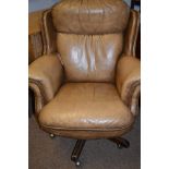 Tan leather office chair.