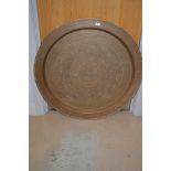 A large circular Middle Eastern brass tray