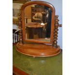 Arched swing mirror.