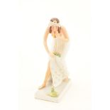 A Rosenthal porcelain figure of a snake charmer.