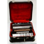 A Hohner Atlantic IVN Musette 120 base piano accordion.