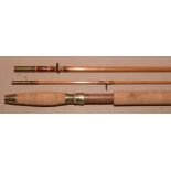 A trout fly fishing rod and green slip.