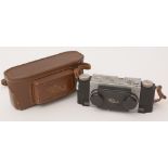 A Realist 35mm stereo camera and lenses.